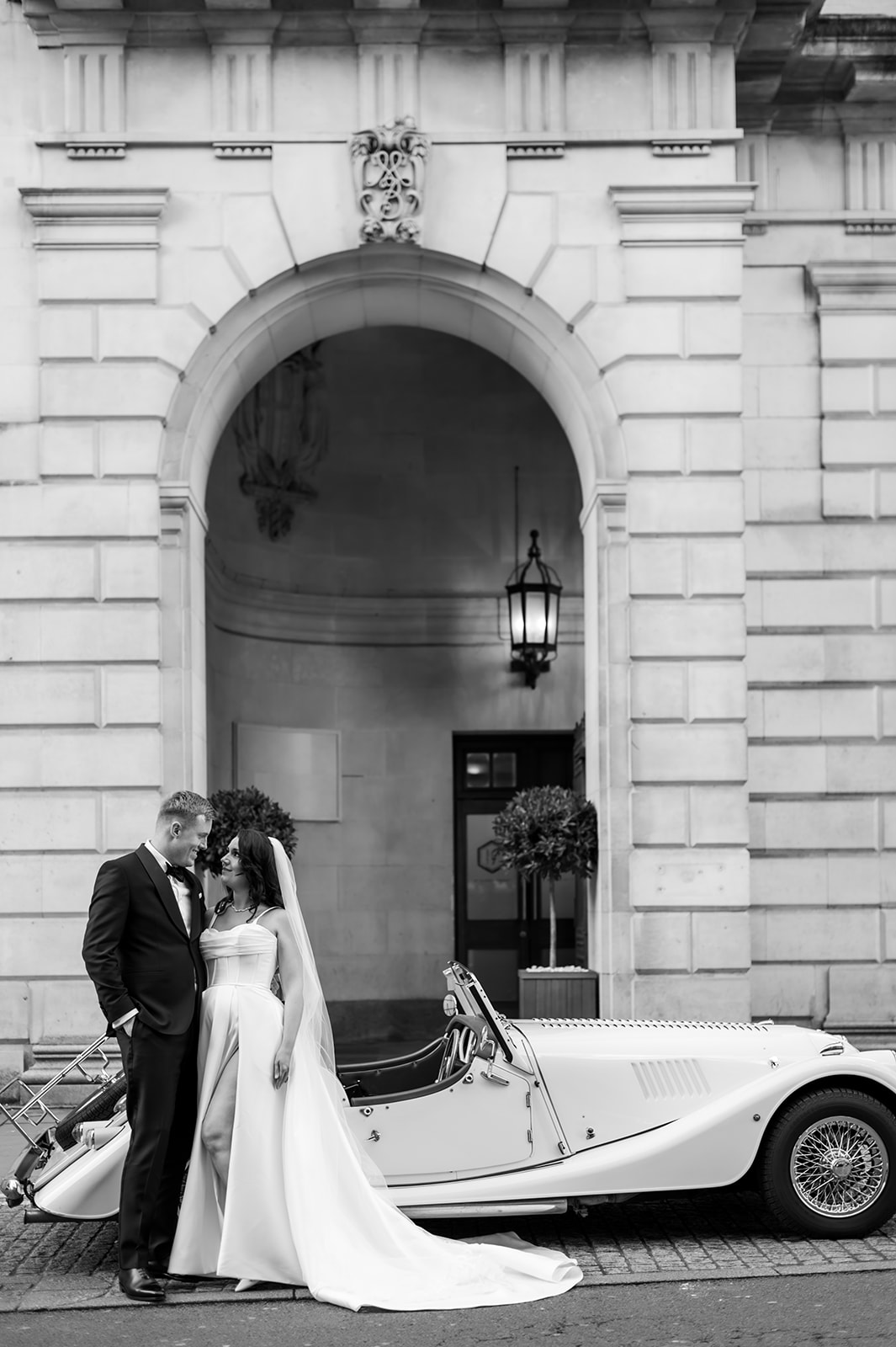 Classic ivory Morgan 4/4 with a bride and groom