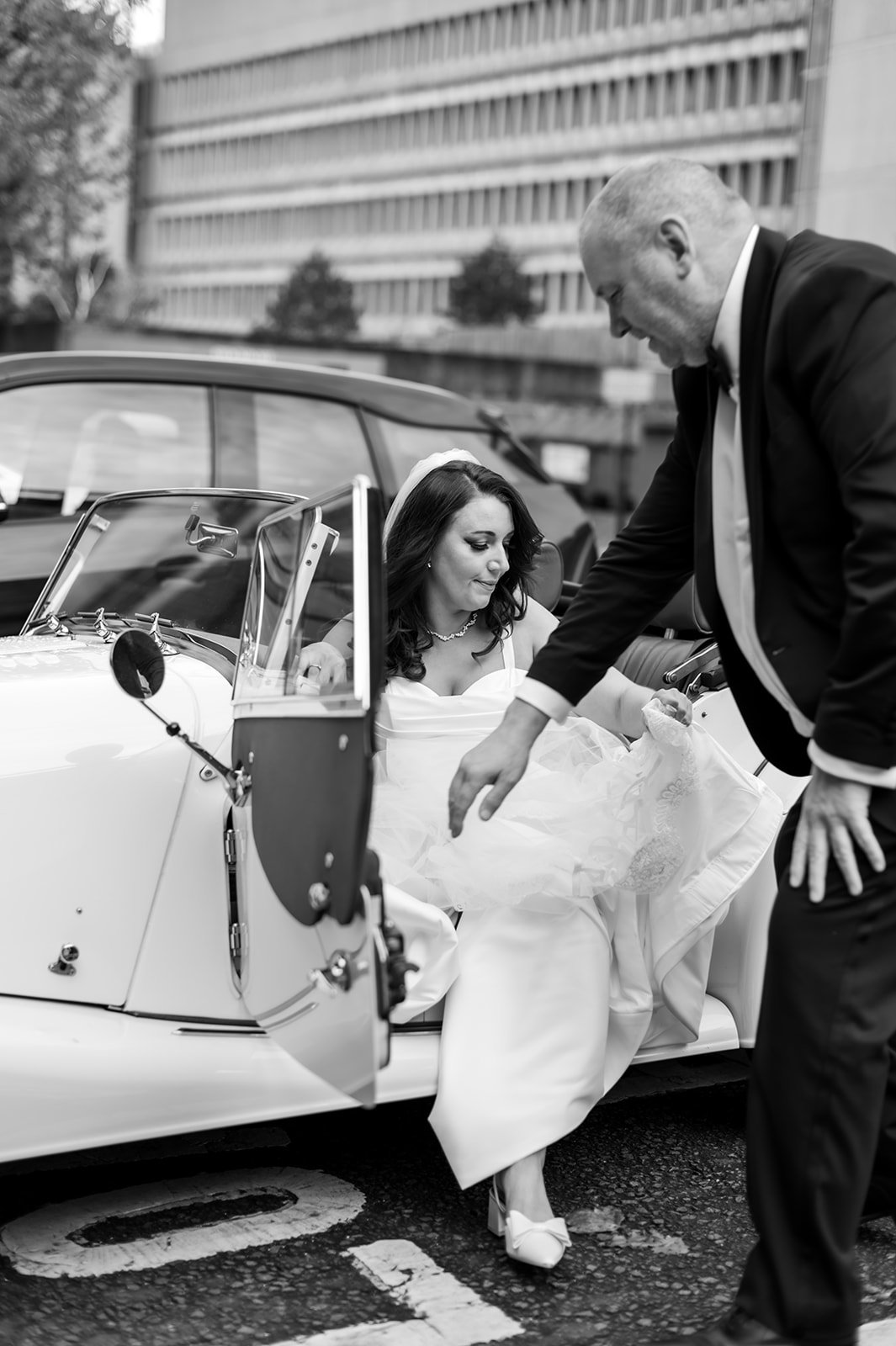 Stuart helping his daughter Zoe out of his Morgan on her wedding day